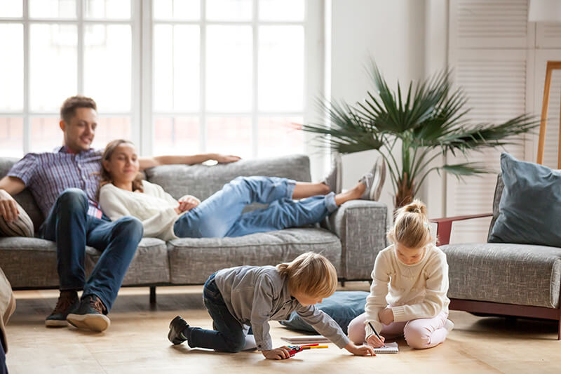 Happy family enjoying home comfort