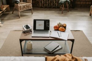 table with laptop and other electronics decorated with gourds