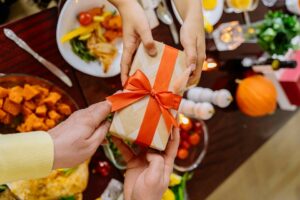 gift exchanged over thanksgiving table