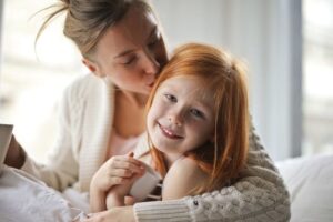 mother and daughter snuggle